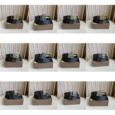 Twelve leather belts coiled in their boxes, each with a different buckle