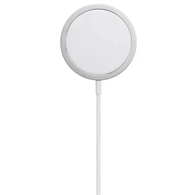 A round magnetic phone charger with its white cable coiled beside it